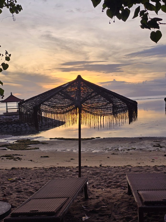 As the sun rises in Sanur Bali